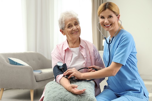 doctor checking blood pressure of a patient