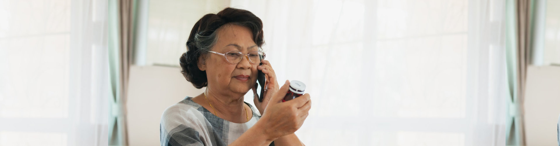 senior woman calling via smart phone